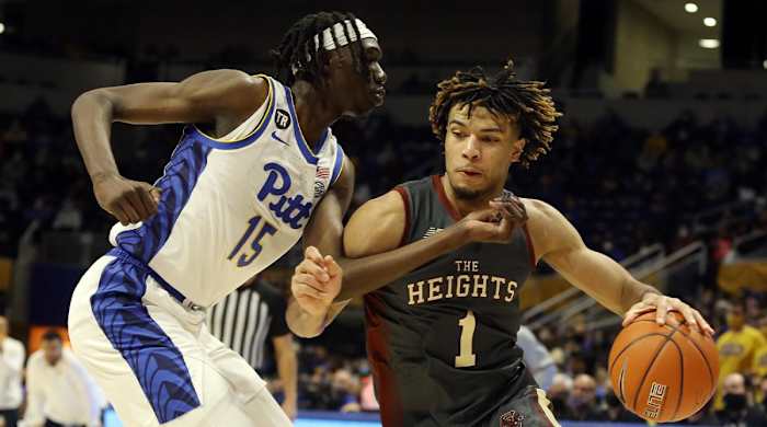 Jan 8, 2022; Pittsburgh, Pennsylvania, USA; Boston College Eagles forward T.J. Bickerstaff (1) drives to the basket against Pittsburgh Panthers forward Mouhamadou Gueye (15) during the second half at the Petersen Events Center. The Panthers won 69-67.